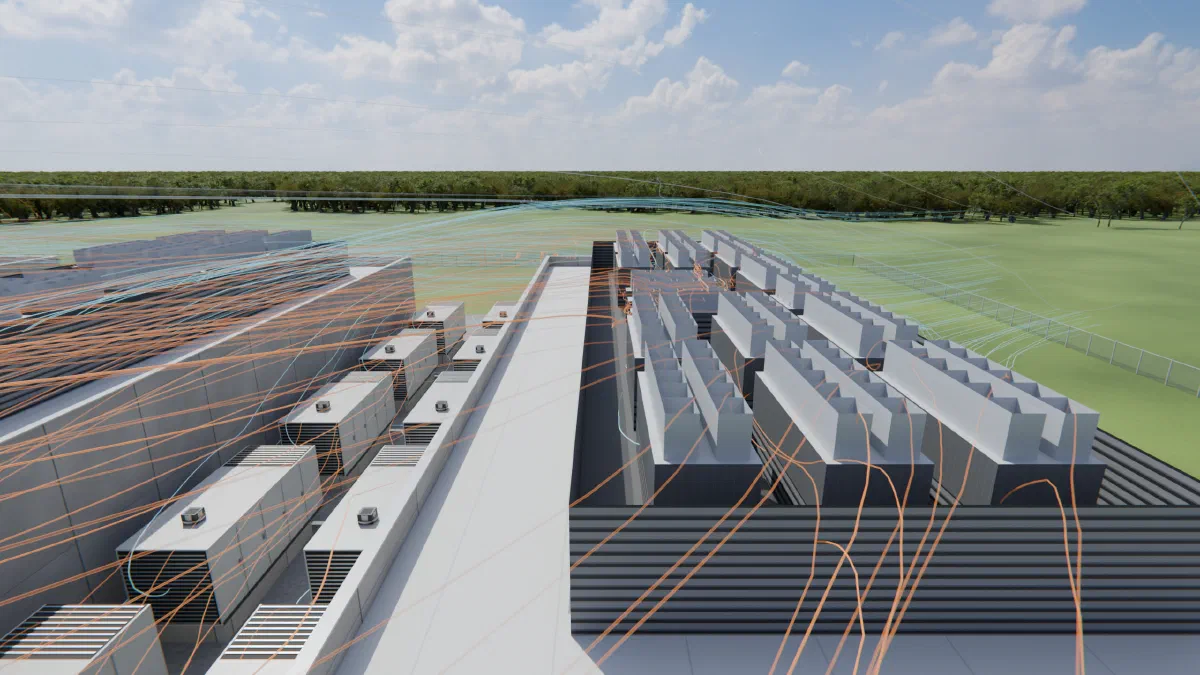 Looking along the gap between two buildings of a data center campus: a row of generators beside one building, banks of condensing units on the neighboring roof, orange lines of warm air drifting across both and blue wind lines beyond
